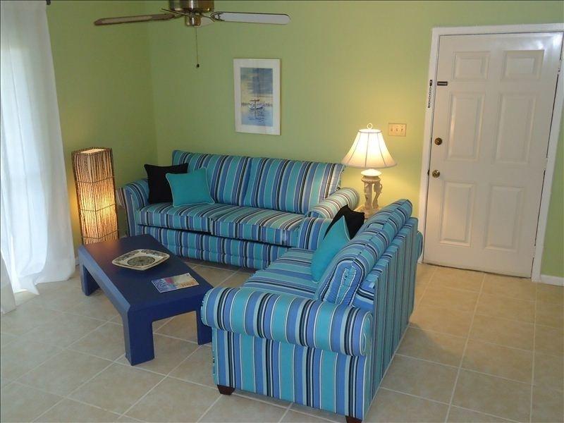 3799 East County Highway 30A, Unit C1 Santa Rosa Beach, FL 32459 - Photo 3 of 8 a living room with furniture and a lamp