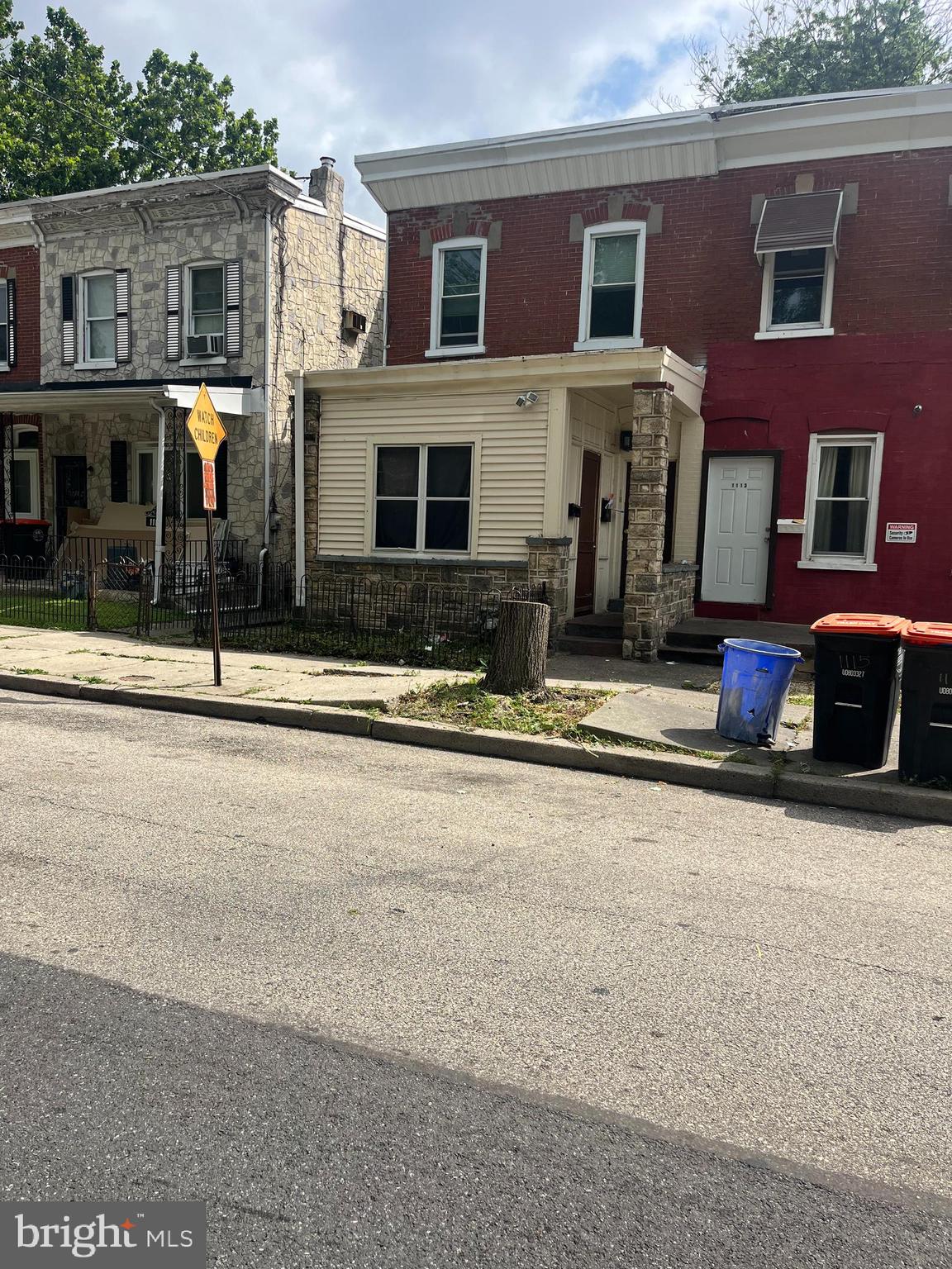 a front view of building with yard