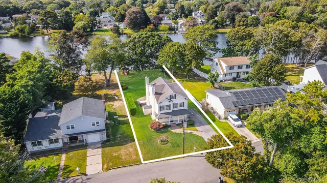 an aerial view of a house with a swimming pool