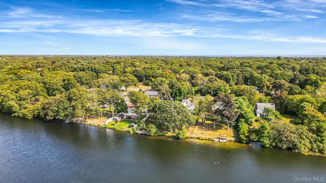 an aerial view of residential houses with ocean view