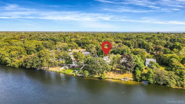 an aerial view of residential houses with ocean view