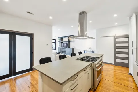 a kitchen that has a lot of cabinets