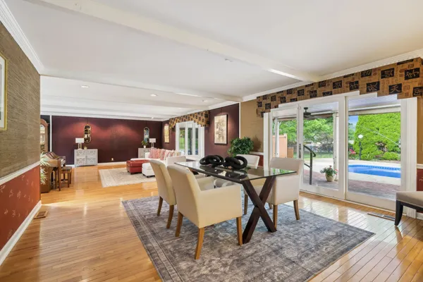 a view of a kitchen with kitchen island dining table and chairs