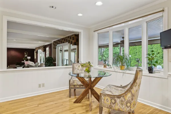 a kitchen with granite countertop white cabinets and stainless steel appliances