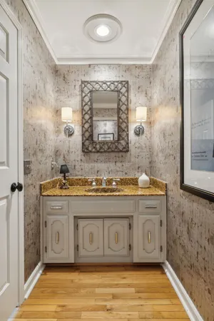 a bathroom with a double vanity sink toilet and shower