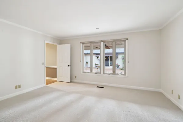 a view of a park and trees in the background