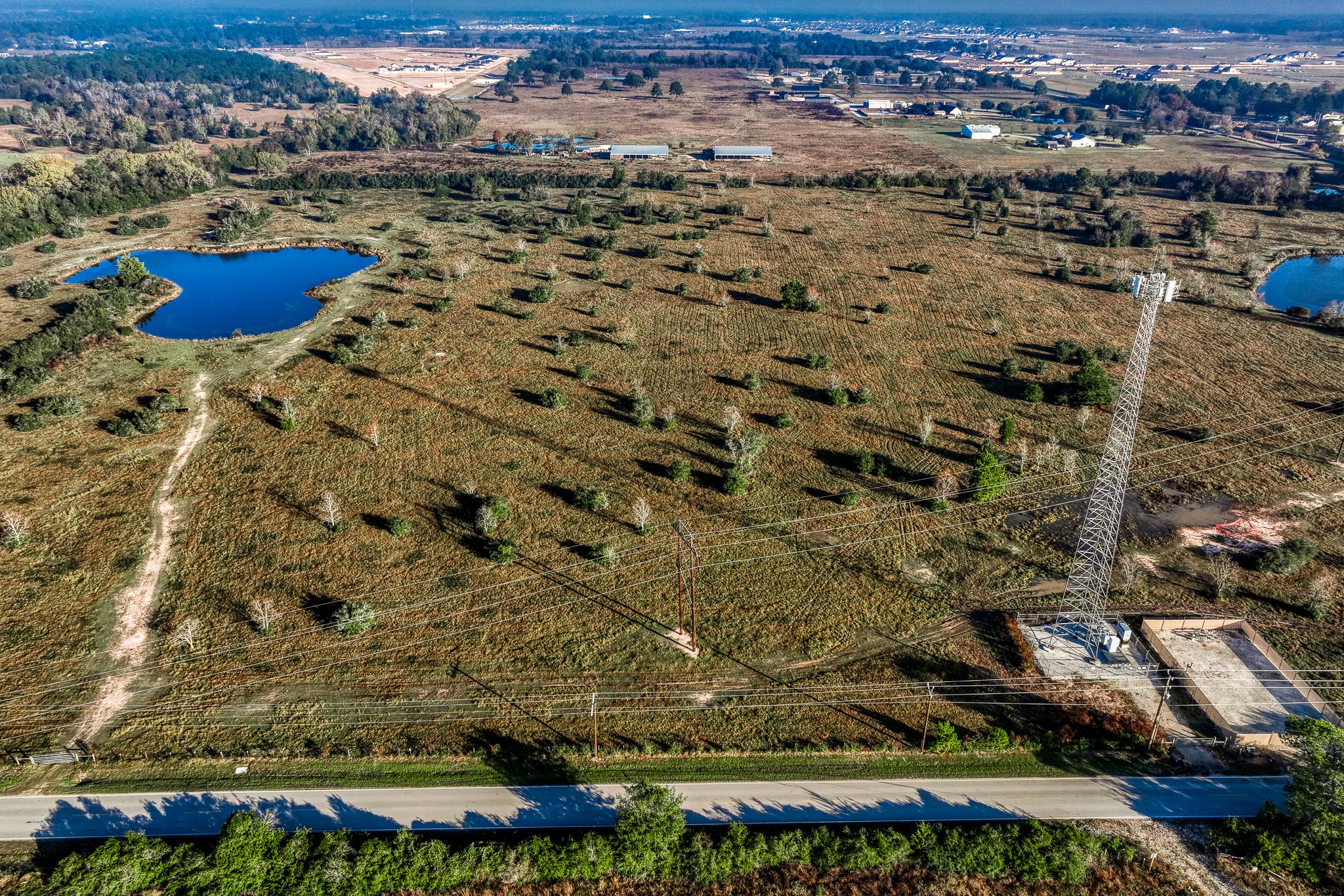an aerial view of residential houses with outdoor space