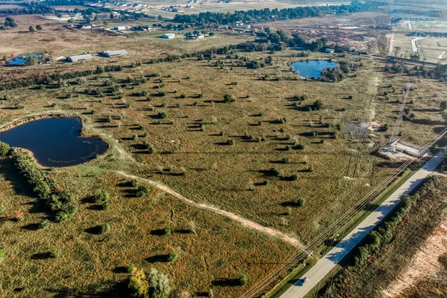 an aerial view of residential houses with outdoor space