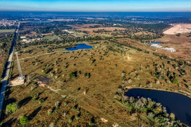 an aerial view of residential houses with outdoor space