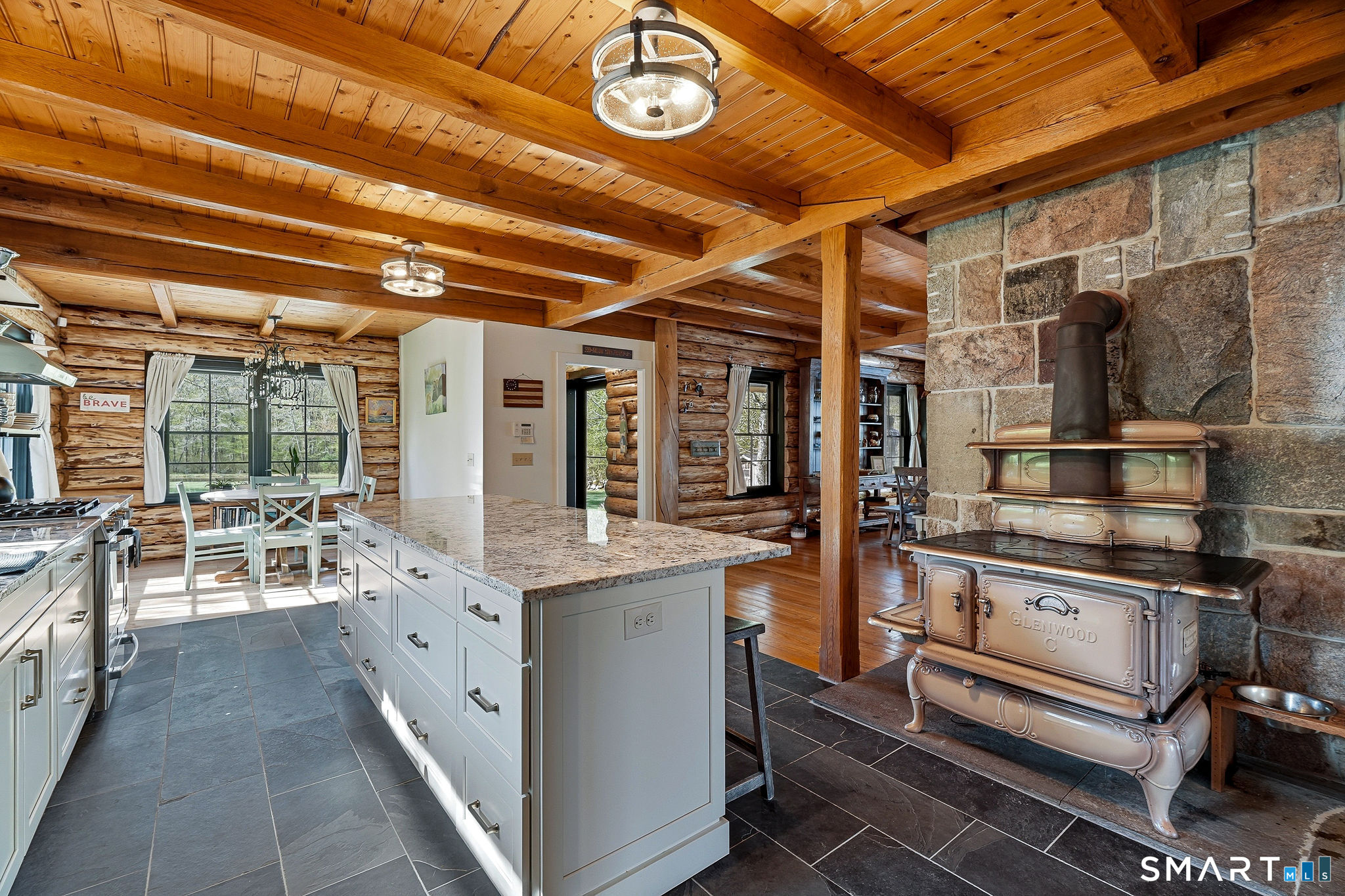 61 Mystic Road North Stonington, CT 06359 - Photo 20 of 40 a open kitchen with stainless steel appliances granite countertop a stove and cabinets