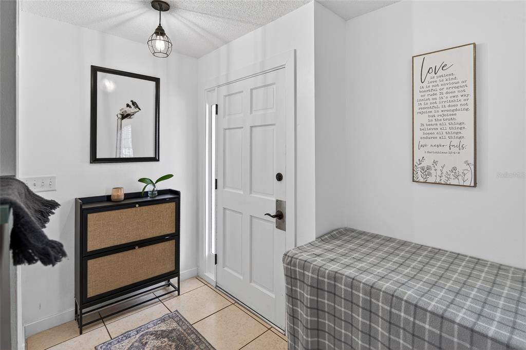 532 Center Road Venice, FL 34285 - Photo 15 of 68 a bedroom with a bed and a window