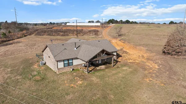 a aerial view of a house with a lake view