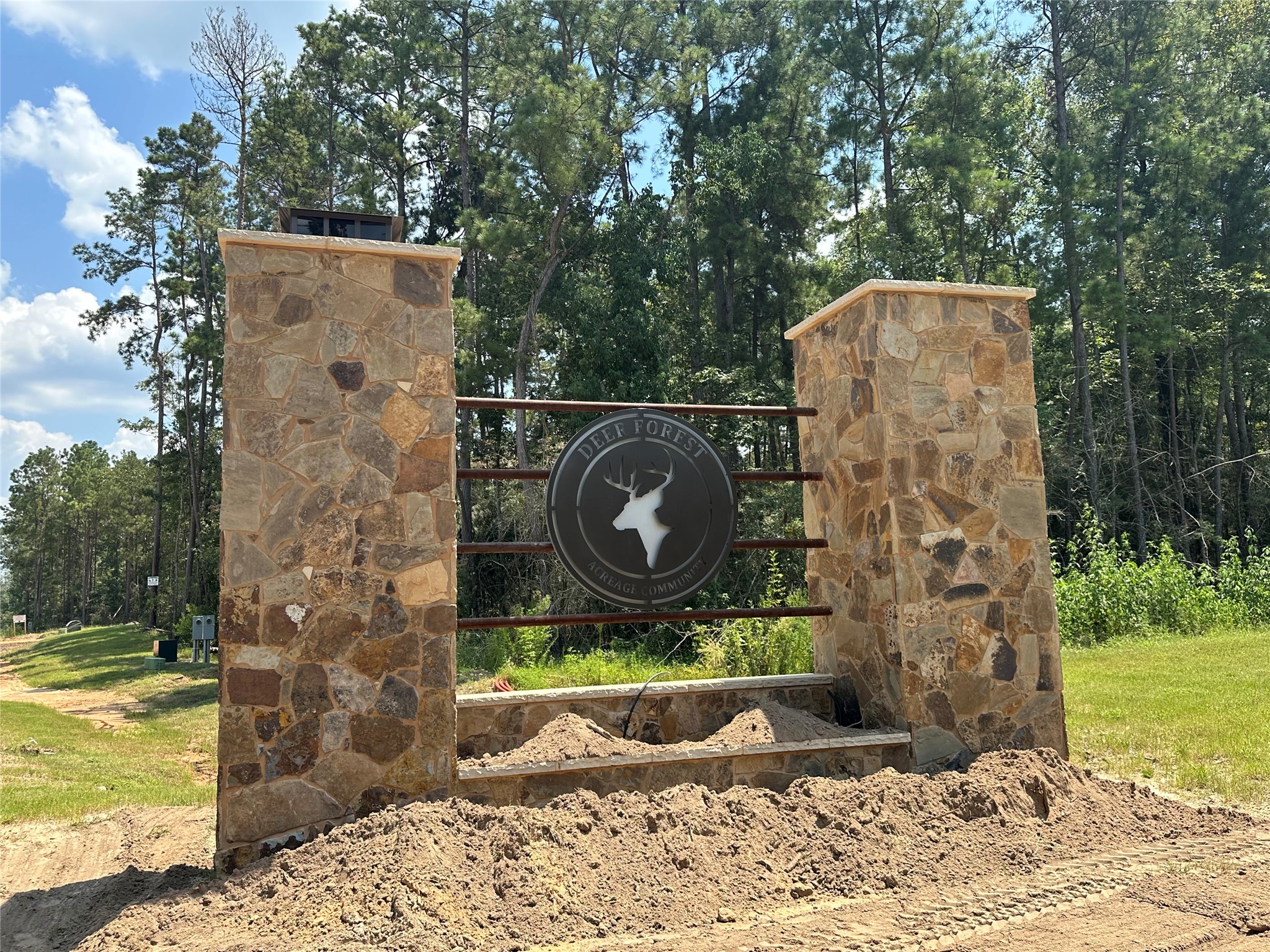 377 Exploration Road New Waverly, TX 77358 - Photo 2 of 7 a view of a wooden door and a yard in back