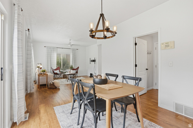 2007 Fielding Hill Lane Draper, UT 84020 - Photo 14 of 83 Dining area featuring a contemporary chandelier and wood-finish flooring