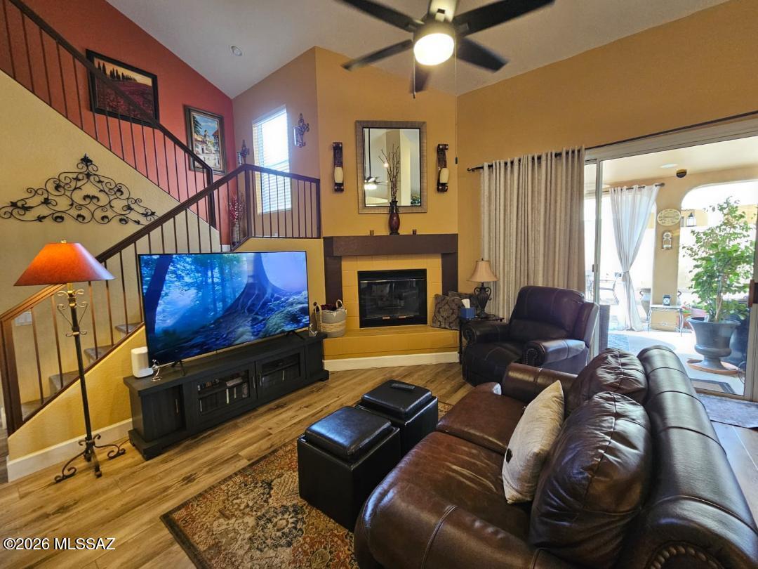 3130 West Star Ranch Trail Tucson, AZ 85742 - Photo 21 of 44 a living room with furniture a fireplace and a flat screen tv