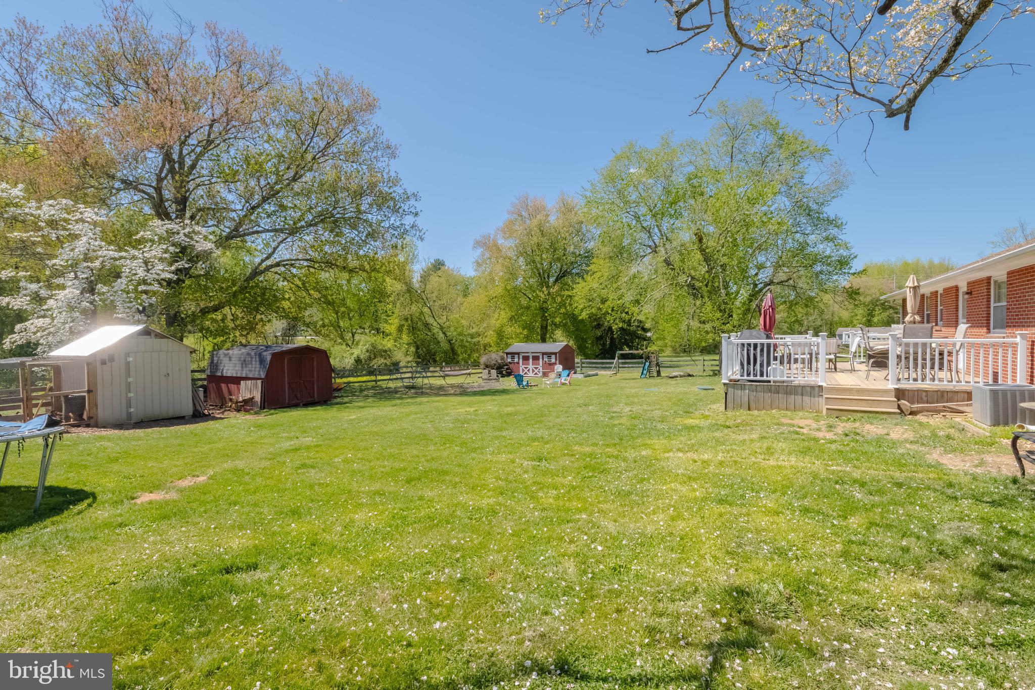 4007 Lee Road Aberdeen, MD 21001 - Photo 49 of 57 a front view of a house with a garden and trees