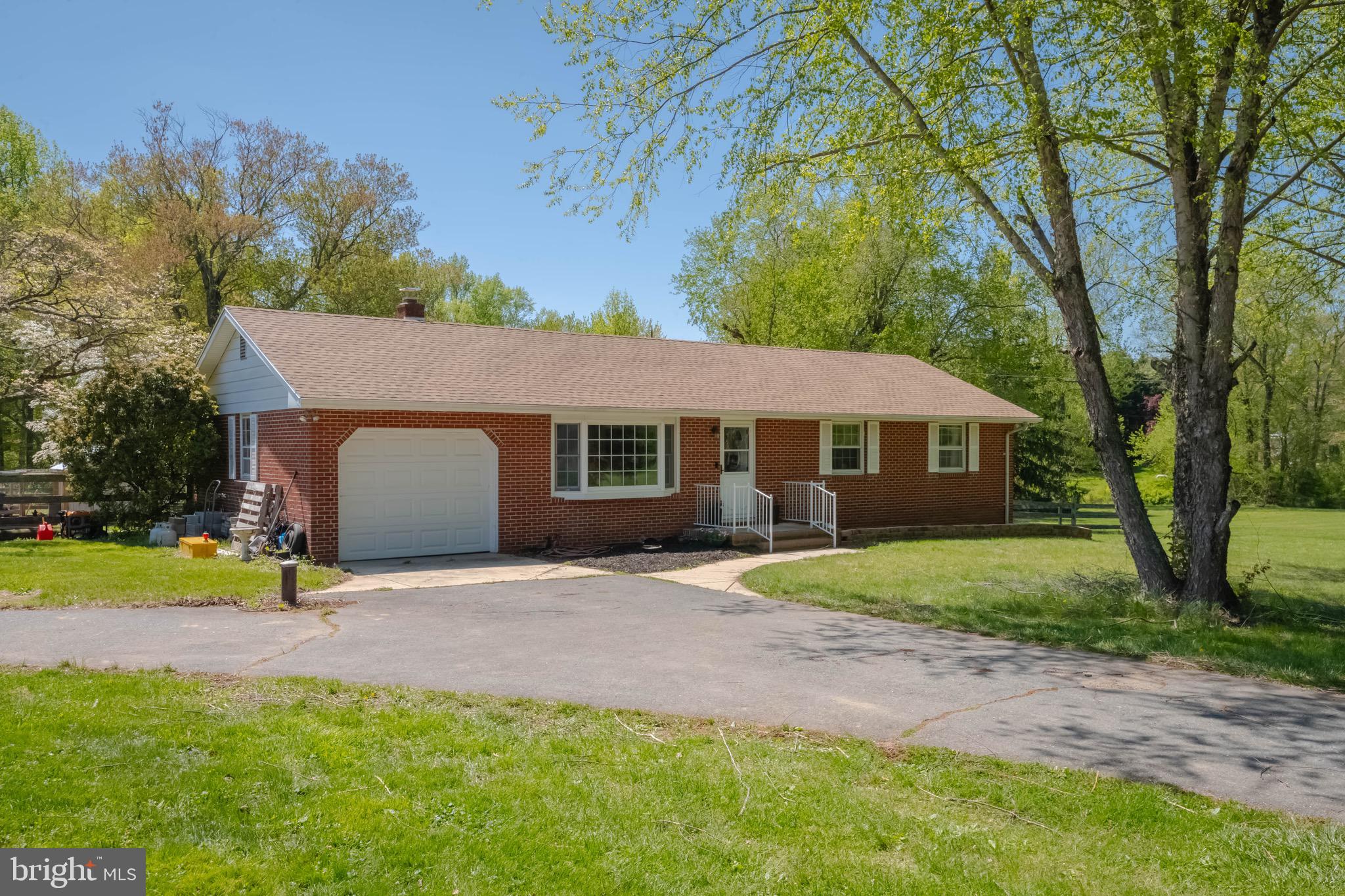 4007 Lee Road Aberdeen, MD 21001 - Photo 5 of 57 a front view of a house with a yard and garage
