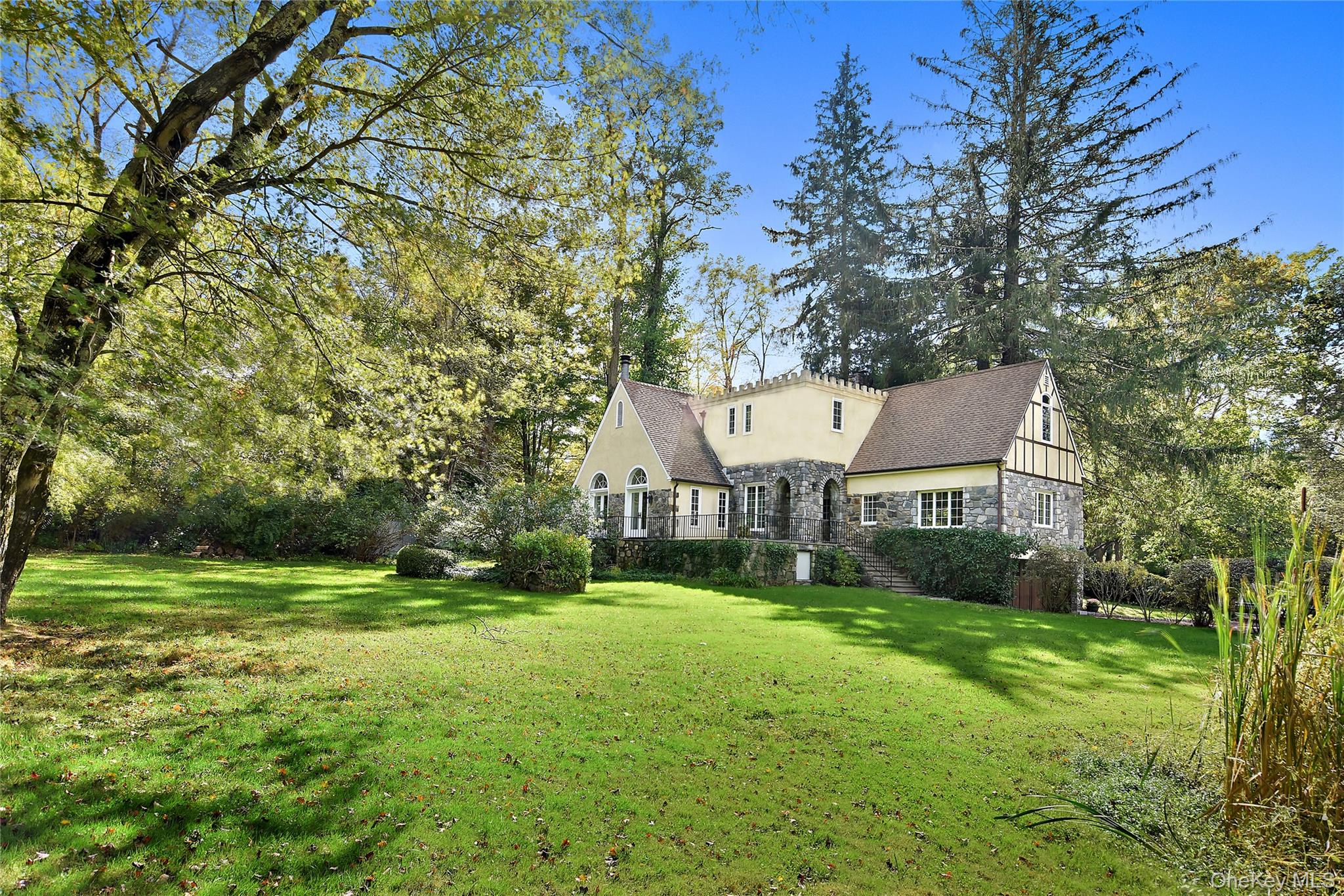 160 Long Ridge Road Bedford, NY 10506 - Photo 2 of 25 a view of a big house with a big yard and large trees