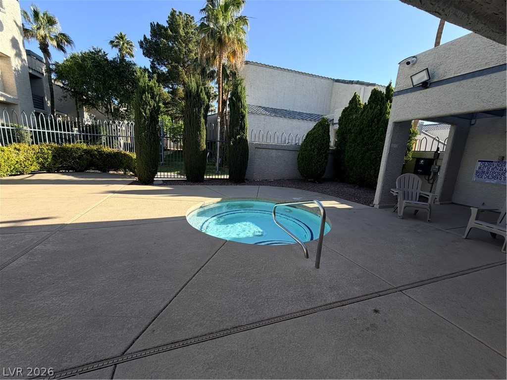 6250 West Flamingo Road, Unit 4 Las Vegas, NV 89103 - Photo 43 of 45 Relax poolside in this inviting community oasis, perfect for enjoying the beautiful outdoors.