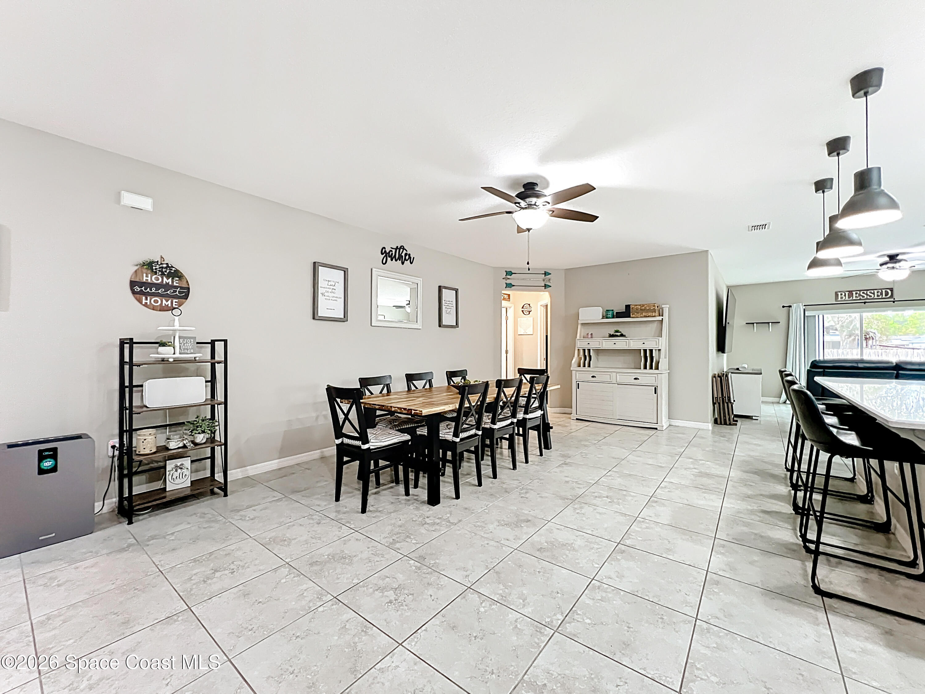 415 Scodella Street Southwest Palm Bay, FL 32908 - Photo 11 of 54 a view of a dining room with furniture