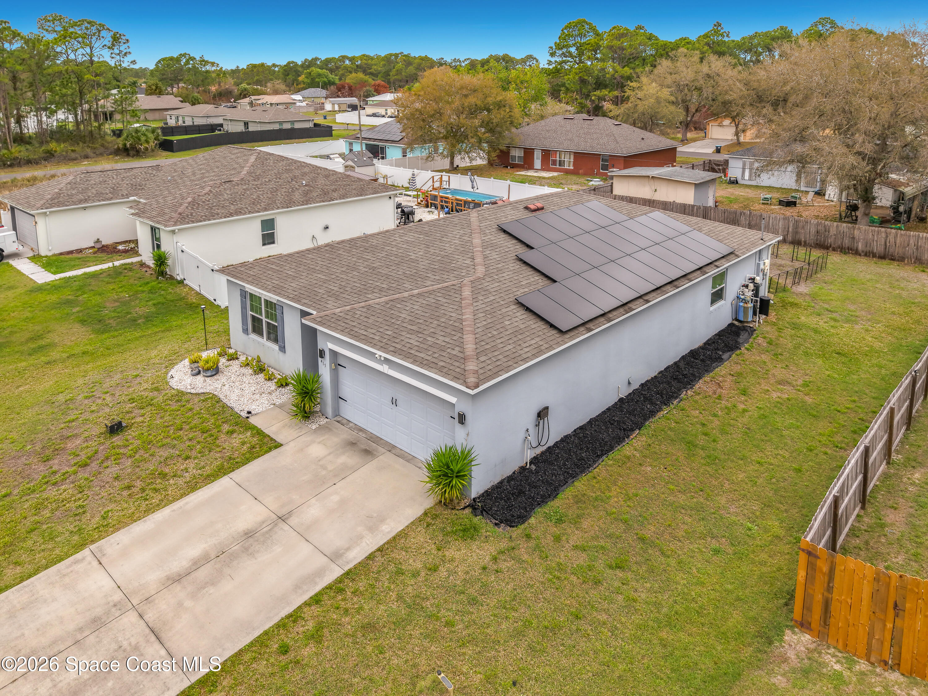 415 Scodella Street Southwest Palm Bay, FL 32908 - Photo 2 of 54 a view of a house with a ocean view