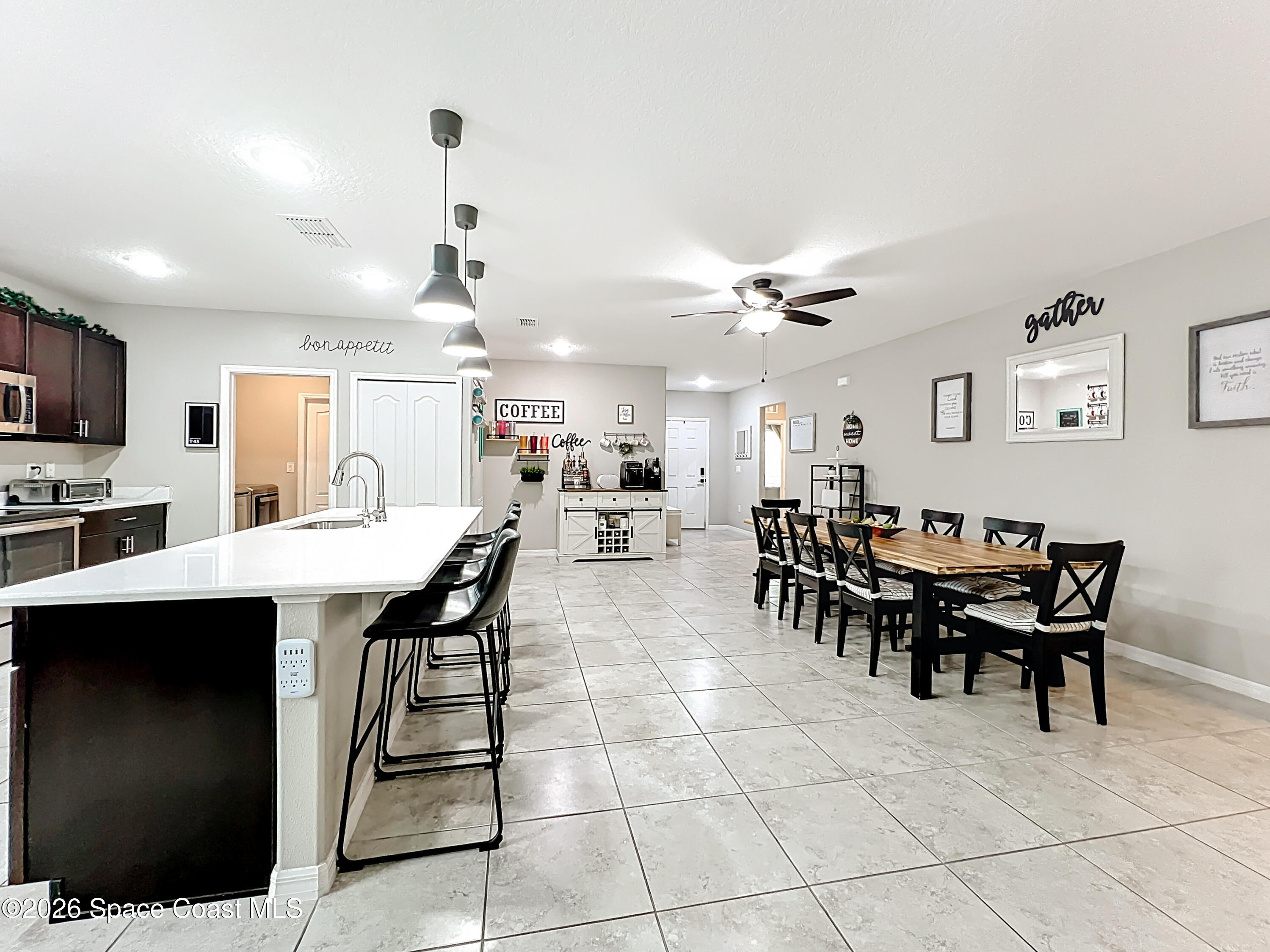 415 Scodella Street Southwest Palm Bay, FL 32908 - Photo 25 of 54 a group of people sitting in a living room