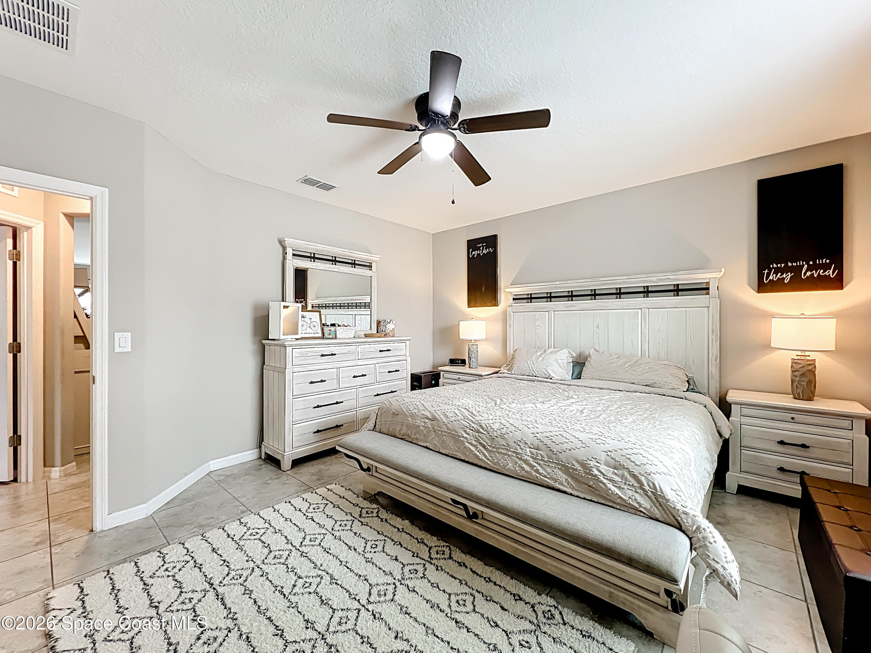 415 Scodella Street Southwest Palm Bay, FL 32908 - Photo 32 of 54 a bedroom with a bed and a flat screen tv