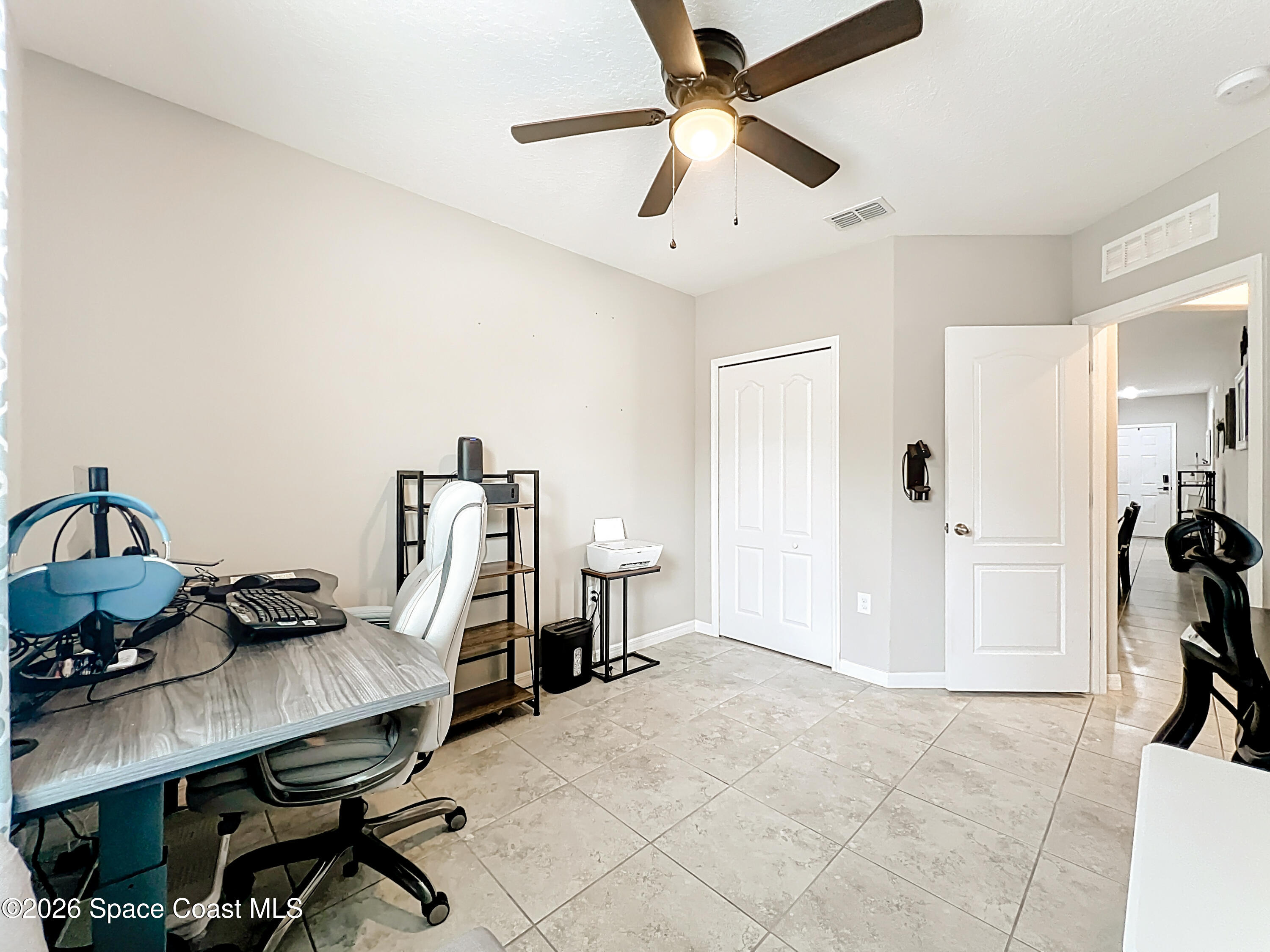415 Scodella Street Southwest Palm Bay, FL 32908 - Photo 36 of 54 a view of a workspace with furniture