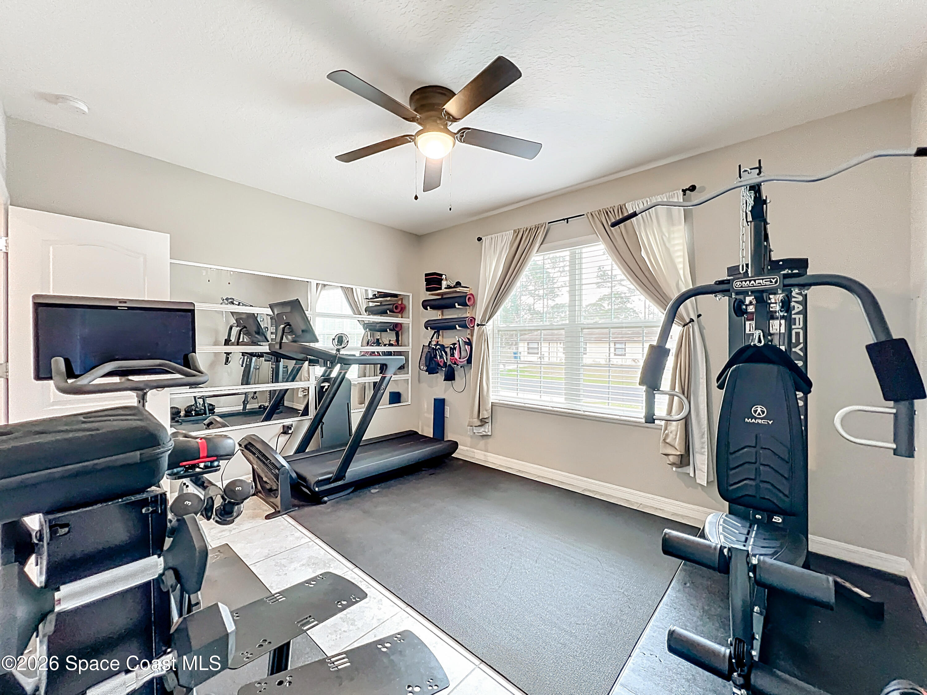 415 Scodella Street Southwest Palm Bay, FL 32908 - Photo 40 of 54 a view of a room with gym equipment