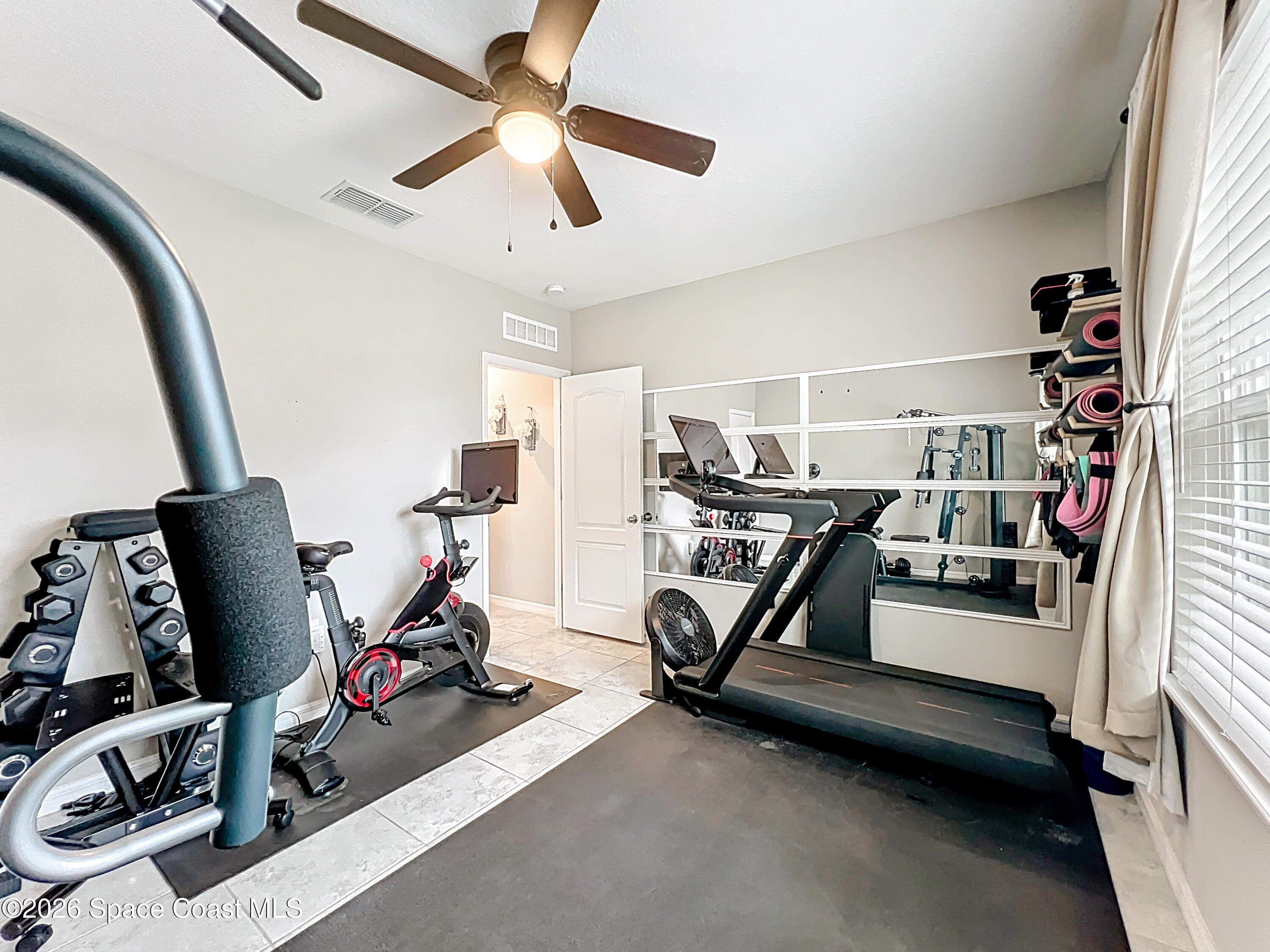 415 Scodella Street Southwest Palm Bay, FL 32908 - Photo 41 of 54 a view of a room with gym equipment