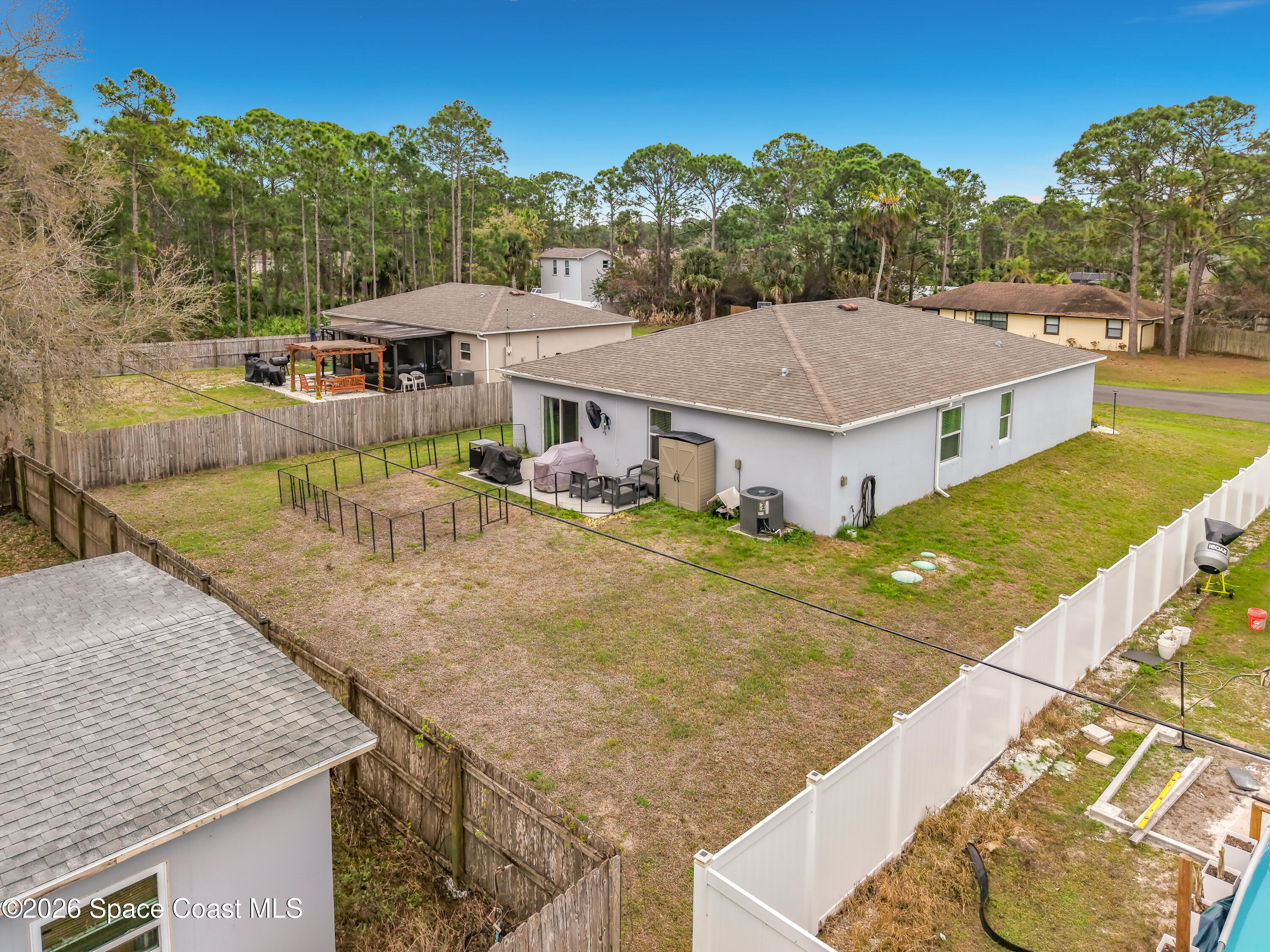415 Scodella Street Southwest Palm Bay, FL 32908 - Photo 49 of 54 a aerial view of a house with a yard