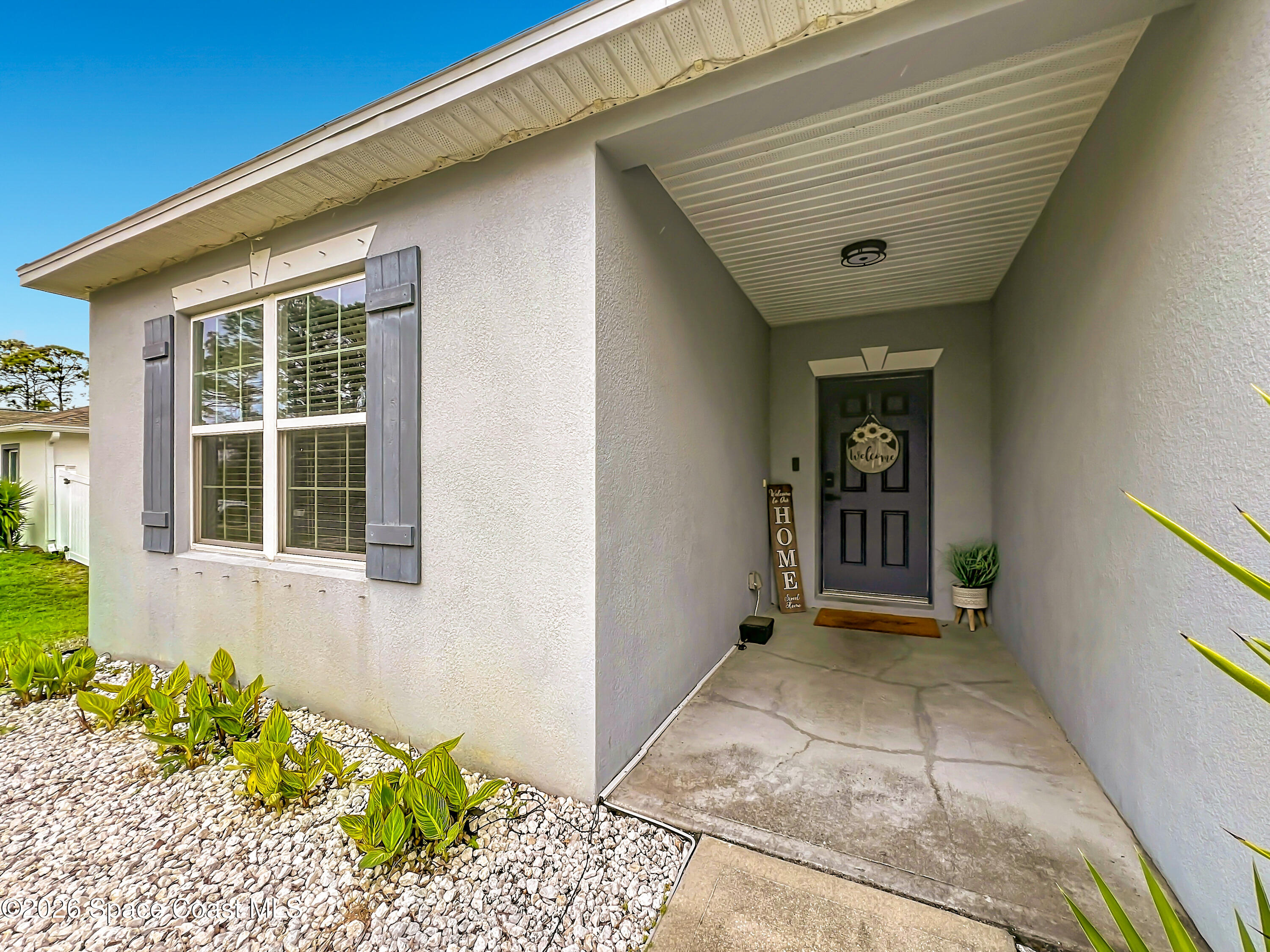 415 Scodella Street Southwest Palm Bay, FL 32908 - Photo 5 of 54 a view of a entryway of the house