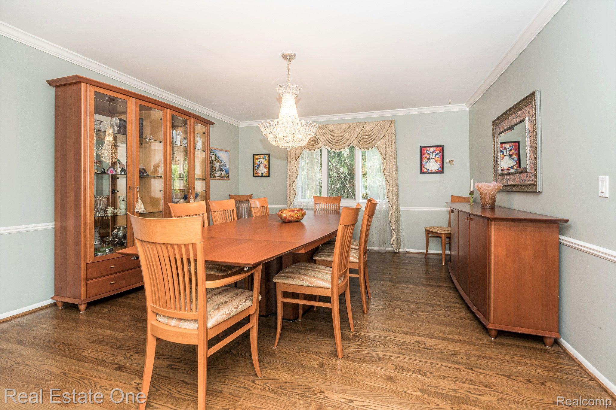 3221 Quail Ridge Circle Rochester, MI 48309 - Photo 20 of 57 Formal Dining Room with Schoenbeck Chandelier