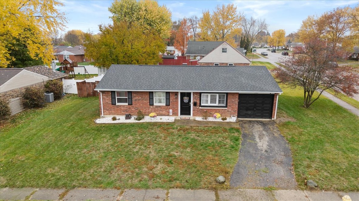 1482 Lee Road Troy, OH 45373 - Photo 2 of 30 This charming brick residence features an attached garage and a welcoming front entrance.
