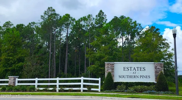 a sign on the side of the park