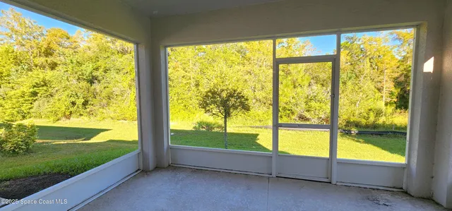 a view of an empty room and floor