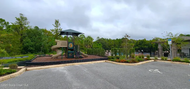 a view of a park with of swings and slides