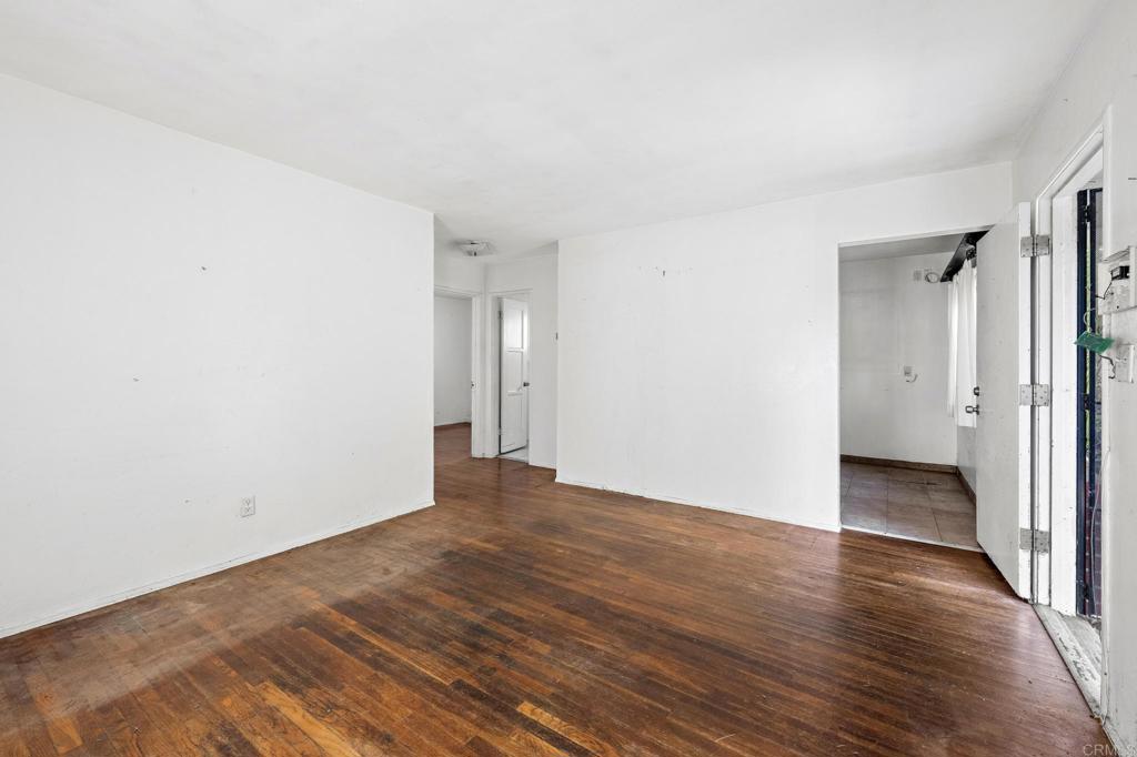 844 Saxony Road Encinitas, CA 92024 - Photo 11 of 31 a view of an empty room with wooden floor