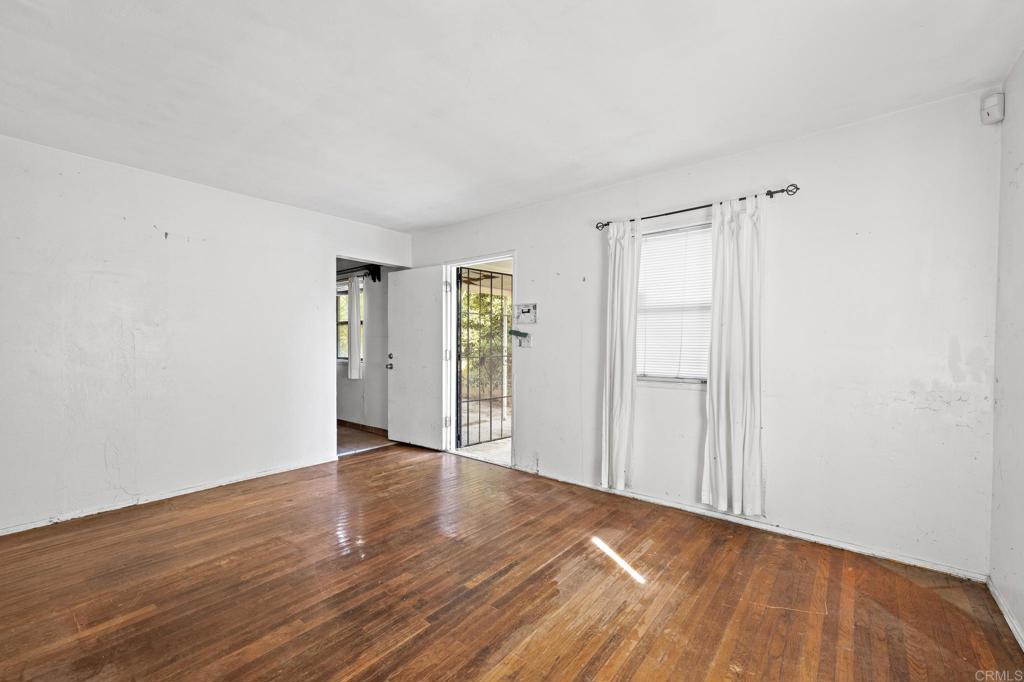 844 Saxony Road Encinitas, CA 92024 - Photo 12 of 31 a view of an empty room with wooden floor
