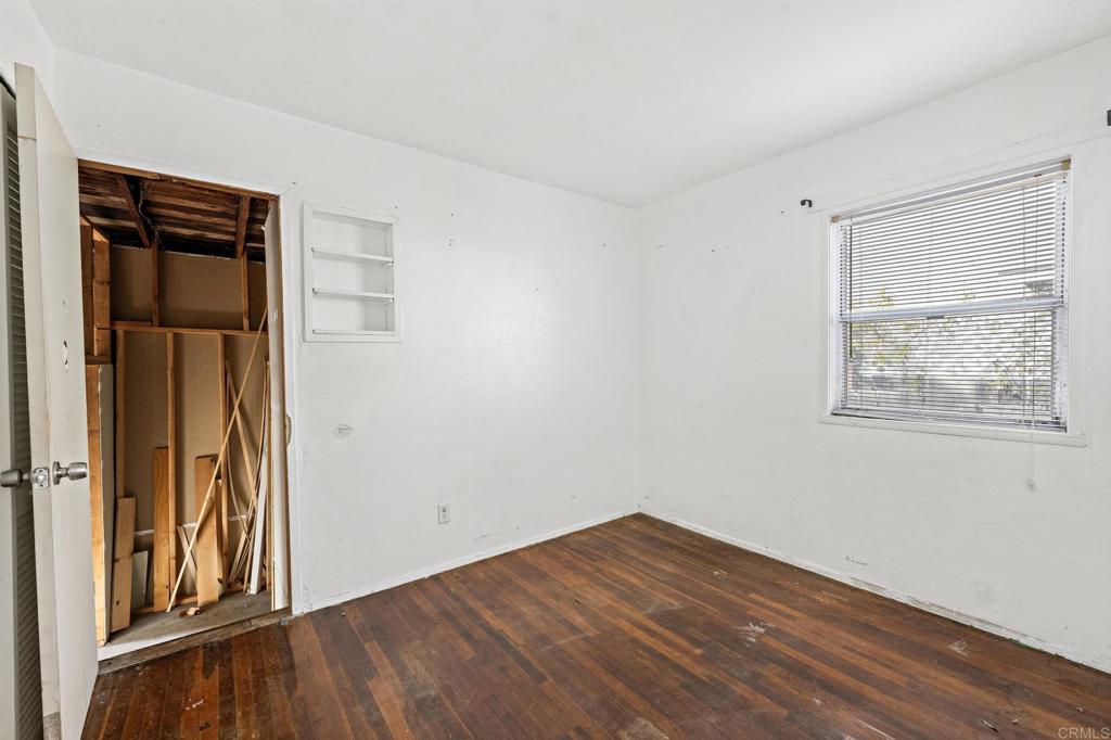 844 Saxony Road Encinitas, CA 92024 - Photo 17 of 31 a view of empty room with wooden floor and fan