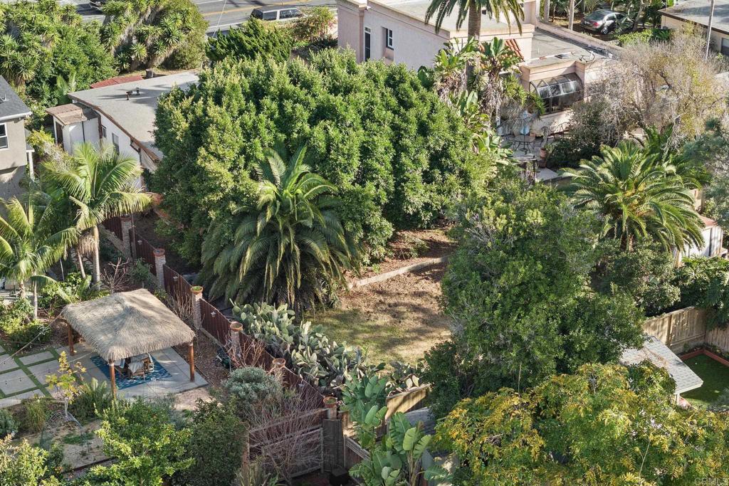 844 Saxony Road Encinitas, CA 92024 - Photo 31 of 31 a backyard of a house with a garden and outdoor seating