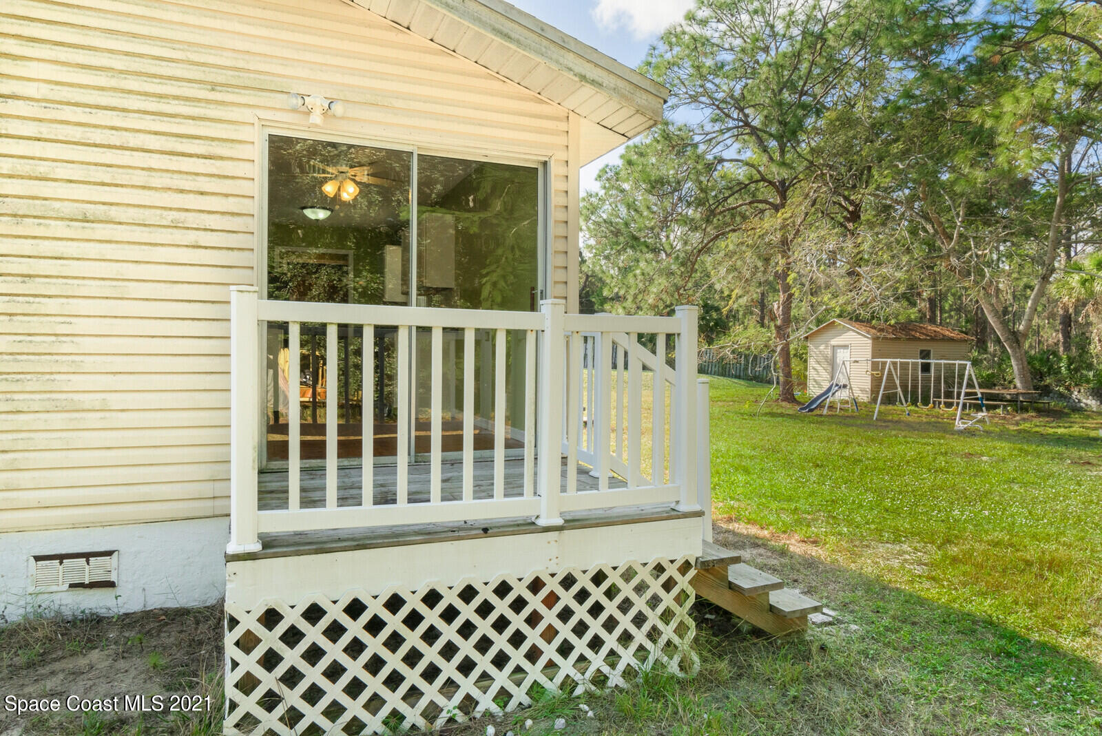 1424 Hanscom Road Southwest Palm Bay, FL 32908 - Photo 14 of 16 a view of a house with a yard