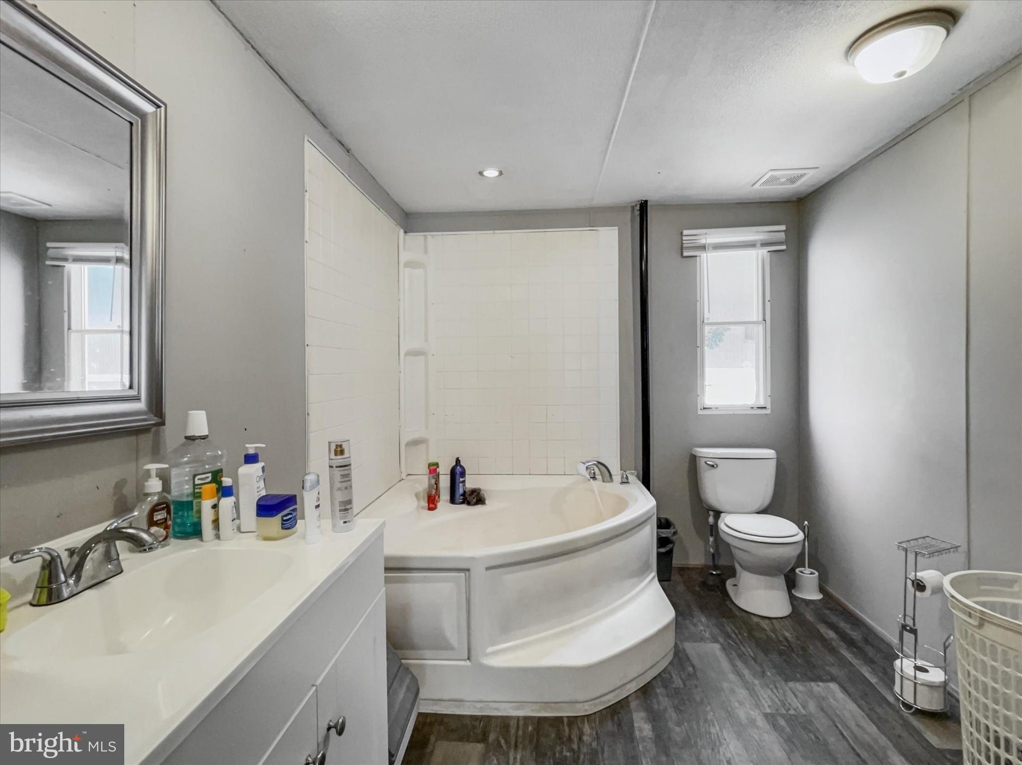 43 B Street York, PA 17408 - Photo 11 of 23 a white toilet sitting next to a bathroom sink