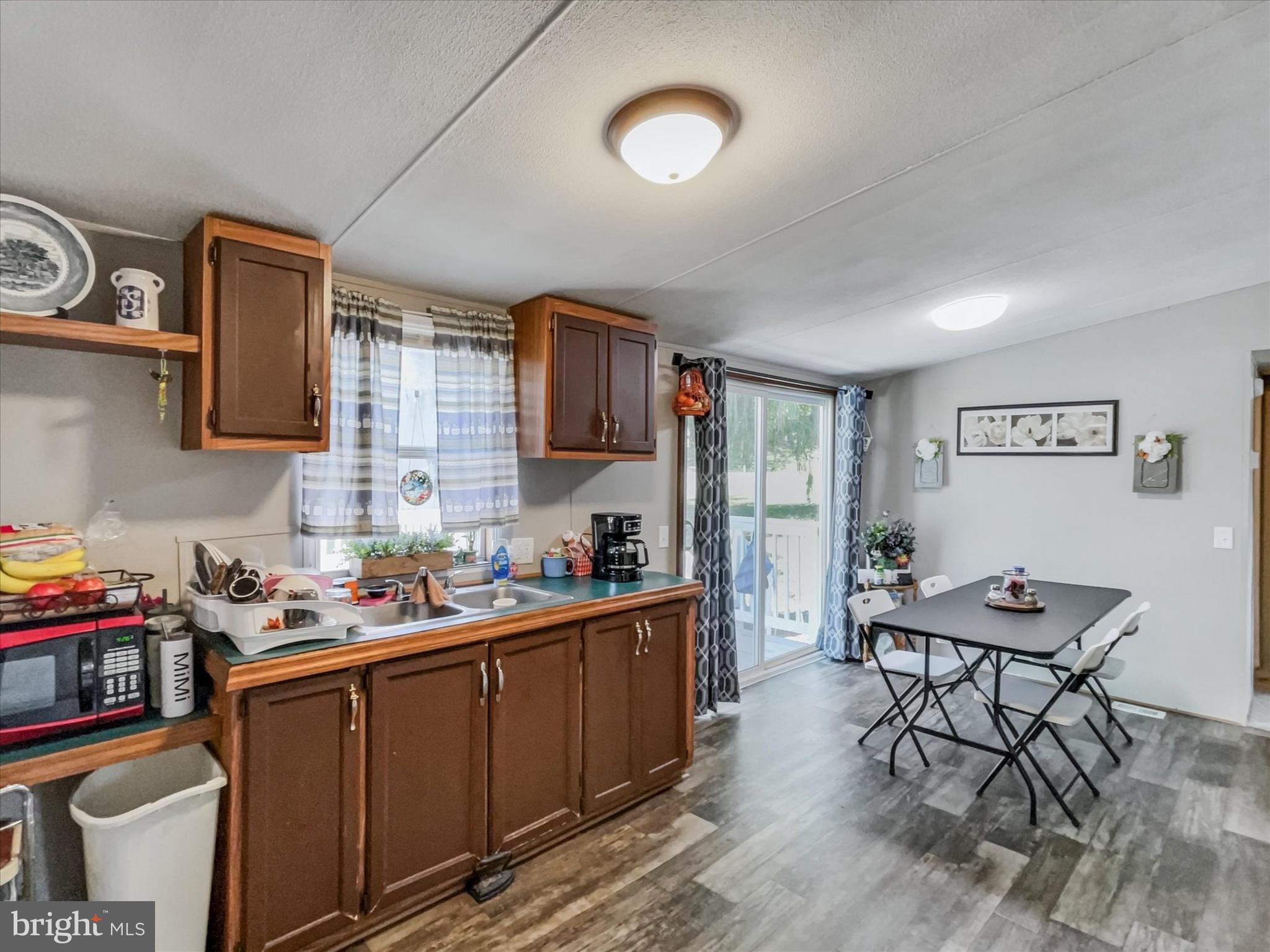 43 B Street York, PA 17408 - Photo 6 of 23 a kitchen with stainless steel appliances a stove a sink dishwasher and cabinets with wooden floor