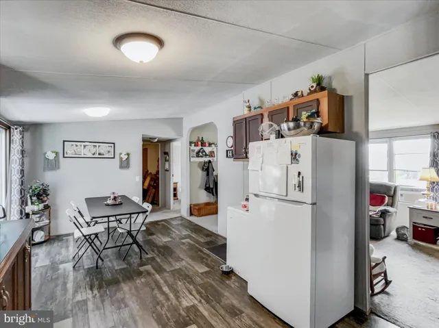 a white refrigerator freezer sitting inside of a kitchen