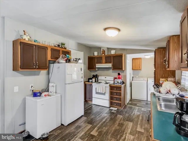 a white refrigerator freezer sitting in a kitchen