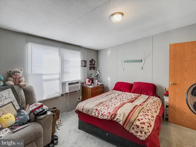 a bedroom with a bed and furniture