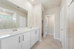 a kitchen with stainless steel appliances granite countertop a refrigerator stove top oven and sink