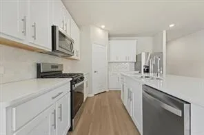 a view of kitchen with wooden floor