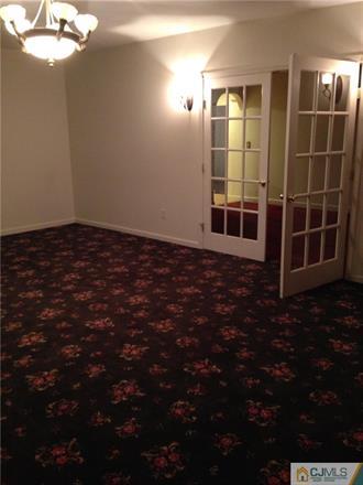164 Eastern Way Rutherford, NJ 07070 - Photo 16 of 25 a view of an empty room with a window
